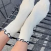 The Petite Ruffled Modal Socks - Soft White + Navy